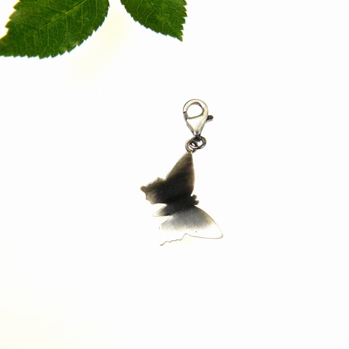 Motylek charms.
